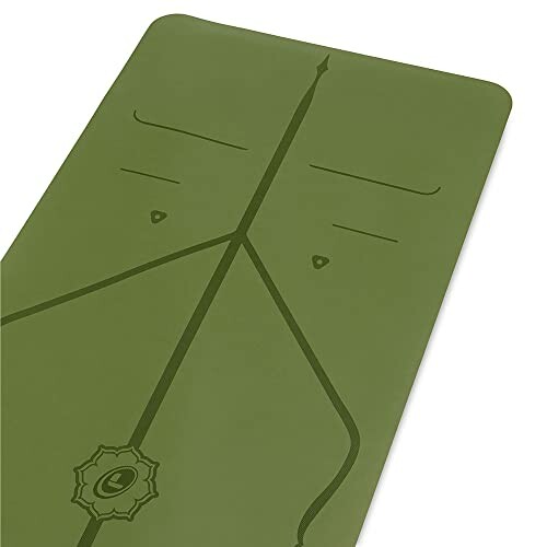 Green yoga mat with alignment lines.