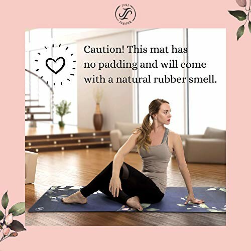 Woman sitting on yoga mat with caution text about no padding.